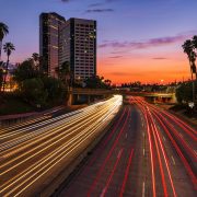 KinseyInvestigations.com Burbank Private Detective - A time-lapse image shows lights from moving traffic against a sunset.