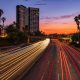 KinseyInvestigations.com Burbank Private Detective - A time-lapse image shows lights from moving traffic against a sunset.