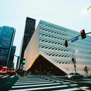 KinseyInvestigations.com Corporate Security Investigations - City buildings and sky scrapers tower over concrete steps.